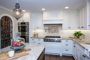 Kitchen counter and stainless steel stove, an island and tile backdrop on the wall, dream kitchen, kitchen, custom kitchen, kitchen remodel, kitchen renovation