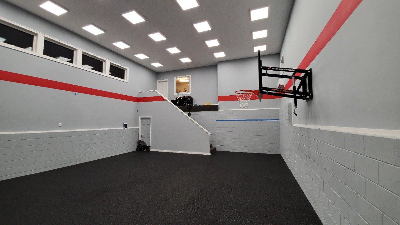 indoor sport court with a basketball hoop