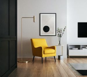 yellow chair sitting in a finished room
